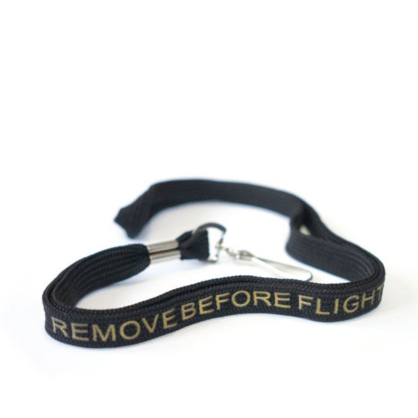 Šňůrka na krk REMOVE BEFORE FLIGHT černá/zlatá