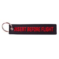 Key Ring “INSERT BEFORE FLIGHT” black / red Key Ring “INSERT BEFORE FLIGHT” black / red