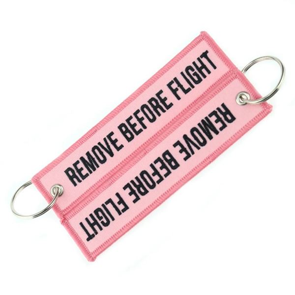 Keyring REMOVE BEFORE FLIGHT light pink
