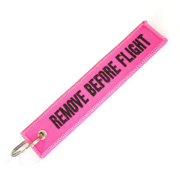 Keyring REMOVE BEFORE FLIGHT pink